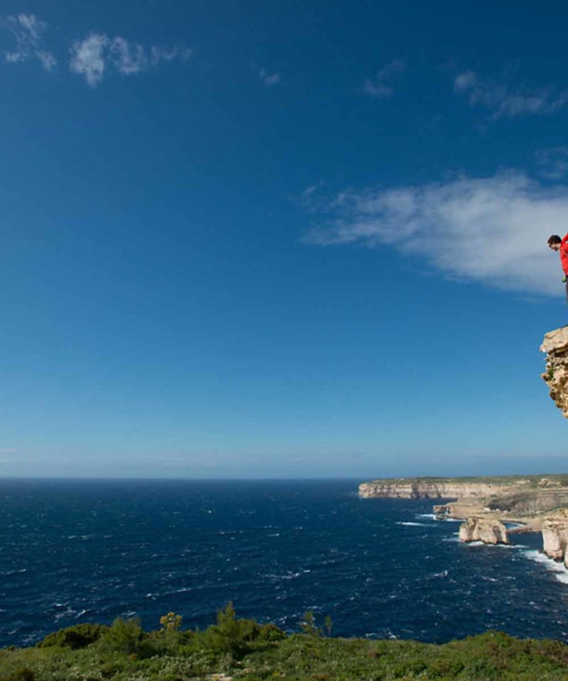 hiker on the cliff-walking holidays in Malta
